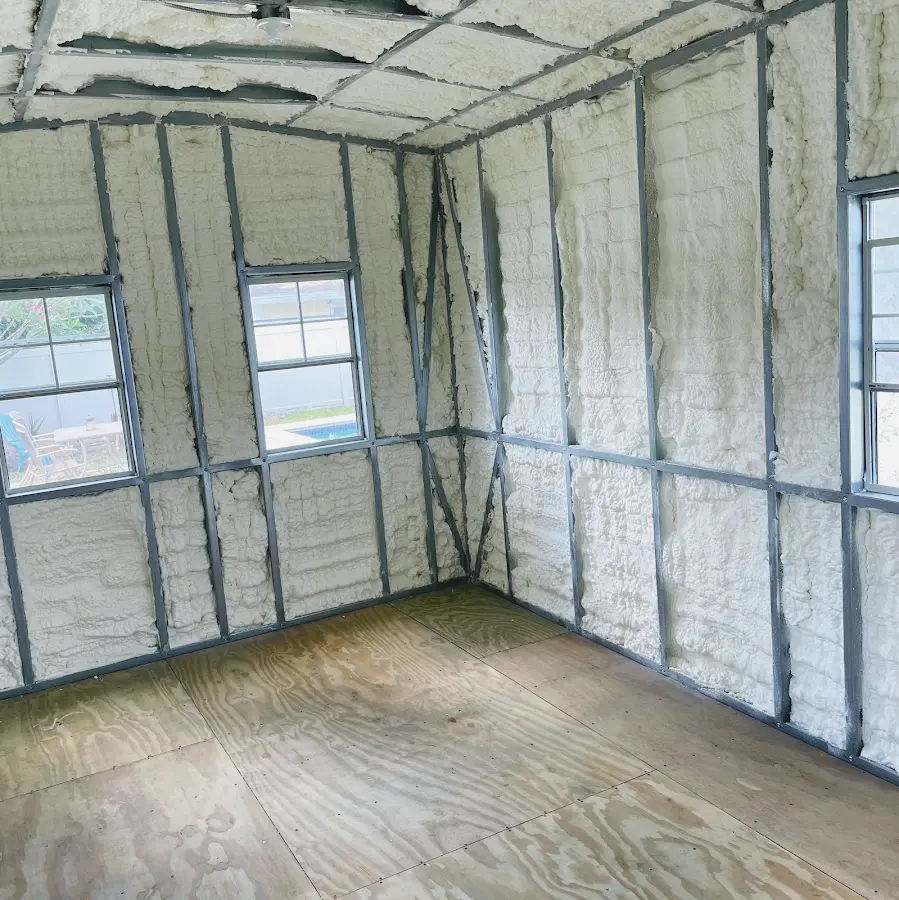 Closed-cell spray foam insulation applied to wall cavities in a residential project in Columbus